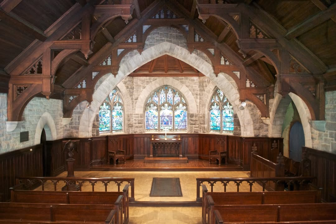 Interior view of the Page Memorial Chapel, built in 1906 by the family of Alanson and Elsie (Benson) Page in their memory. The chapel is famed for its Tiffany stained glass windows and memorial tablets.