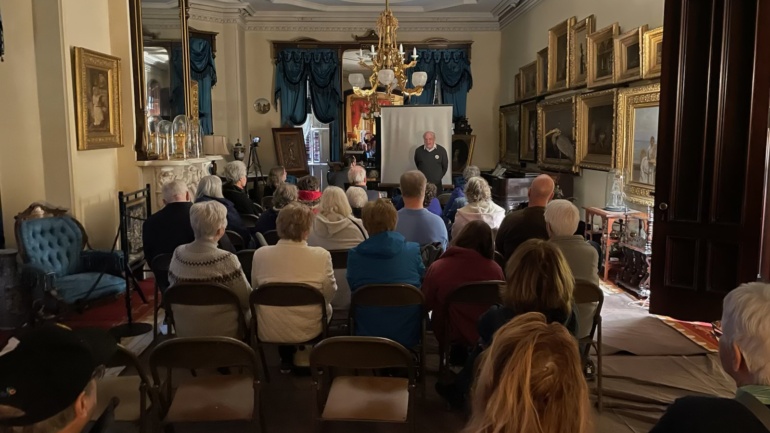 Attendees of the Medal of Honor Day 2025 event watch on as speakers are introduced.